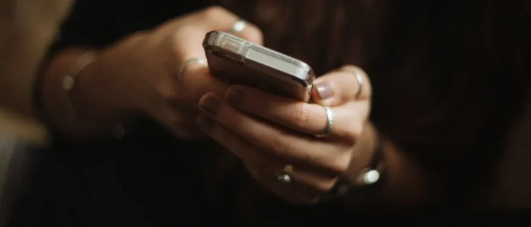 hands holding a cell phone
