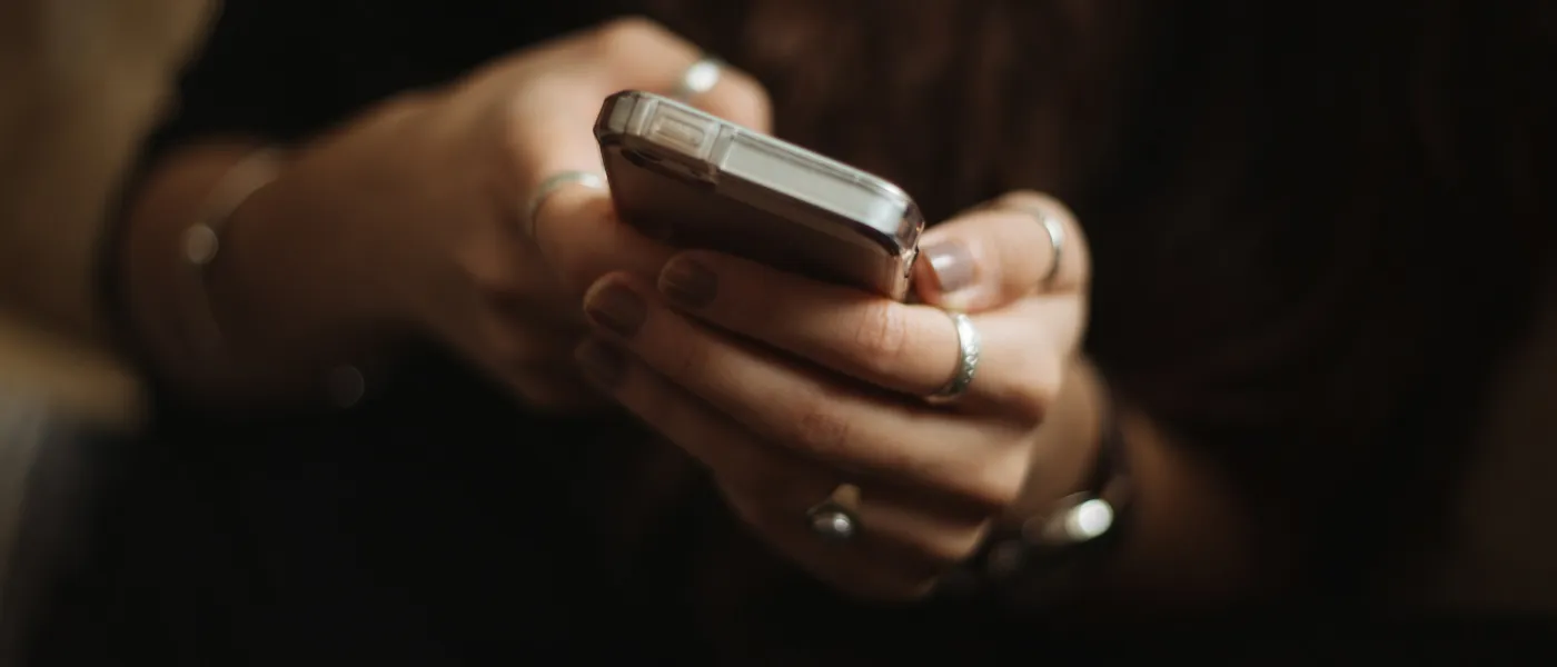 hands holding a cell phone