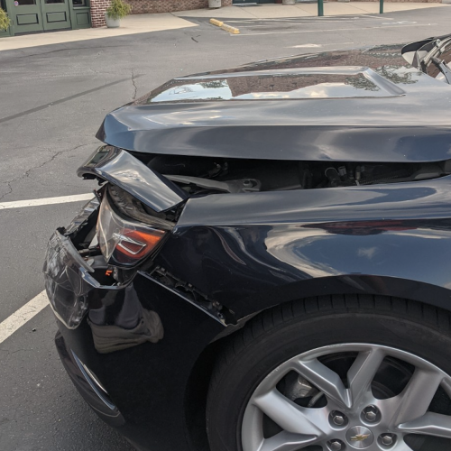 car with ruined hood