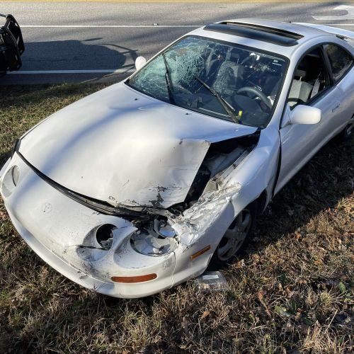 totaled white car
