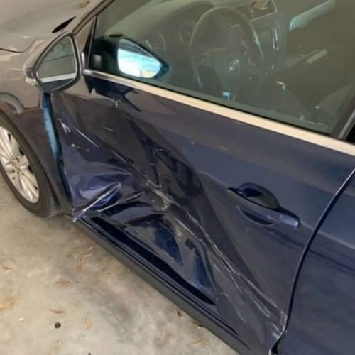 smashed driver's side car door