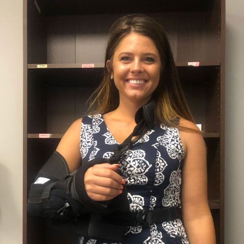 Injured client in arm sling