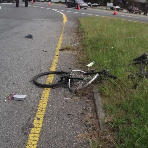 wrecked bicycle on the side of the road
